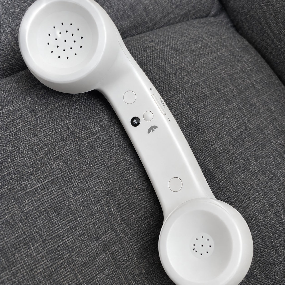 Customer photo: White Novapix Bluetooth Retro Handset on a grey sofa