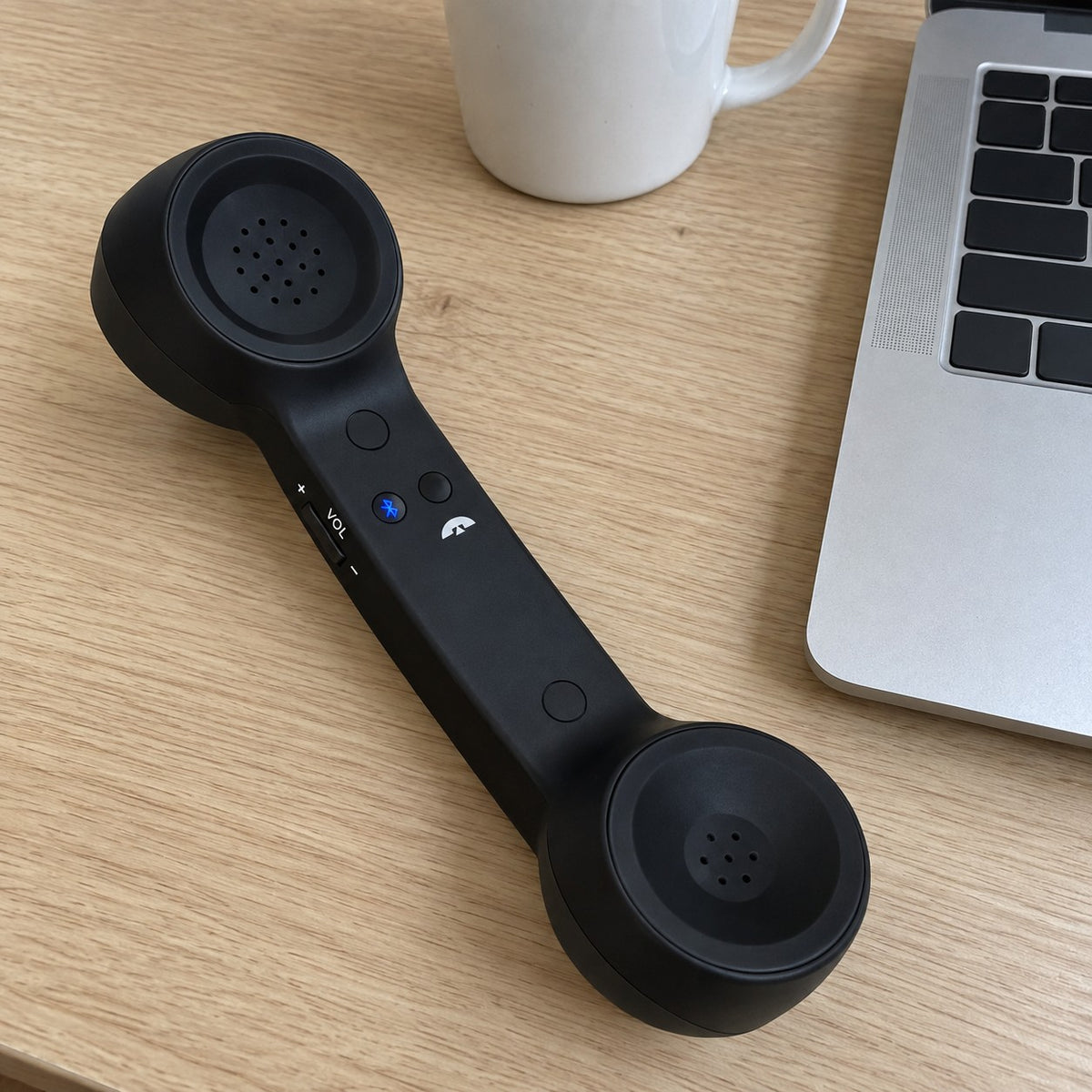 Customer photo: Black Novapix Bluetooth Retro Handset on a desk beside a laptop